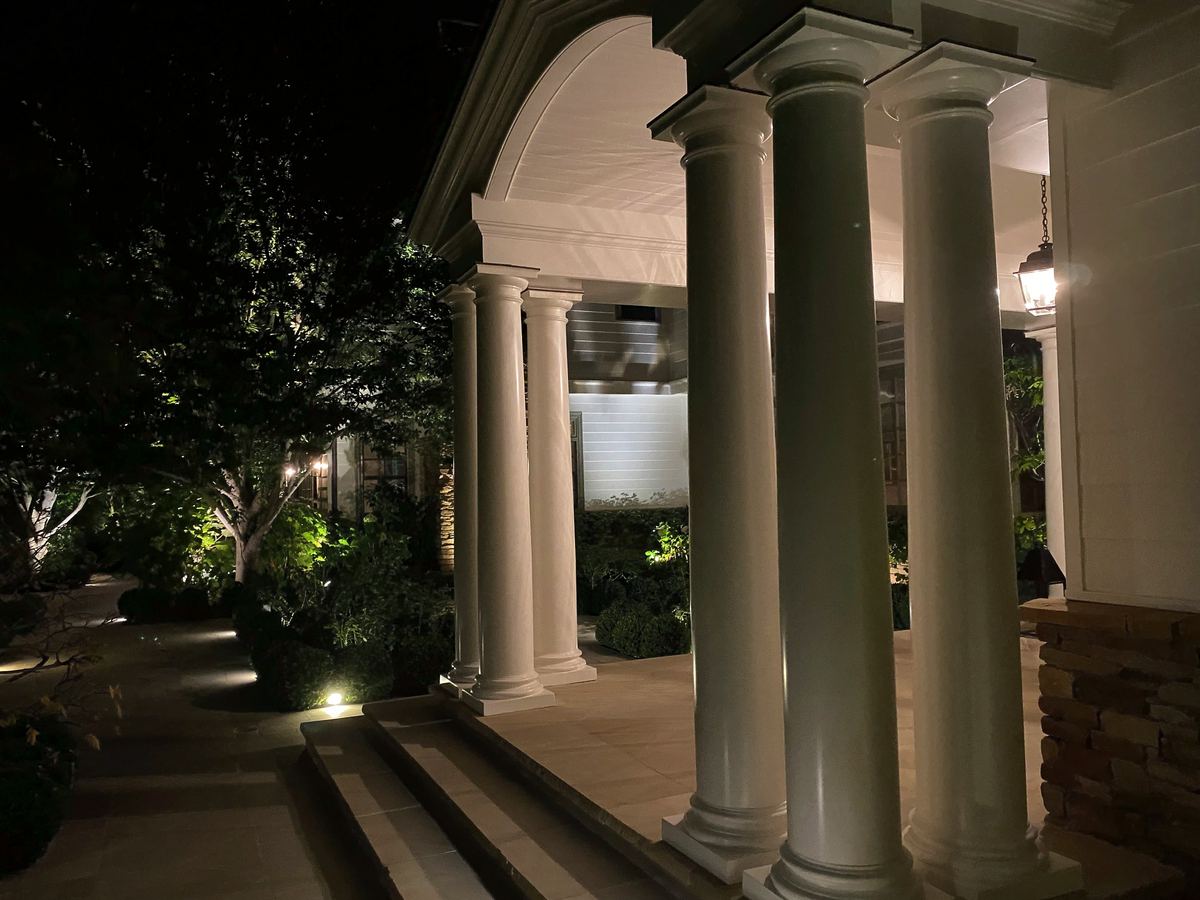 Lit colonnade porch steps