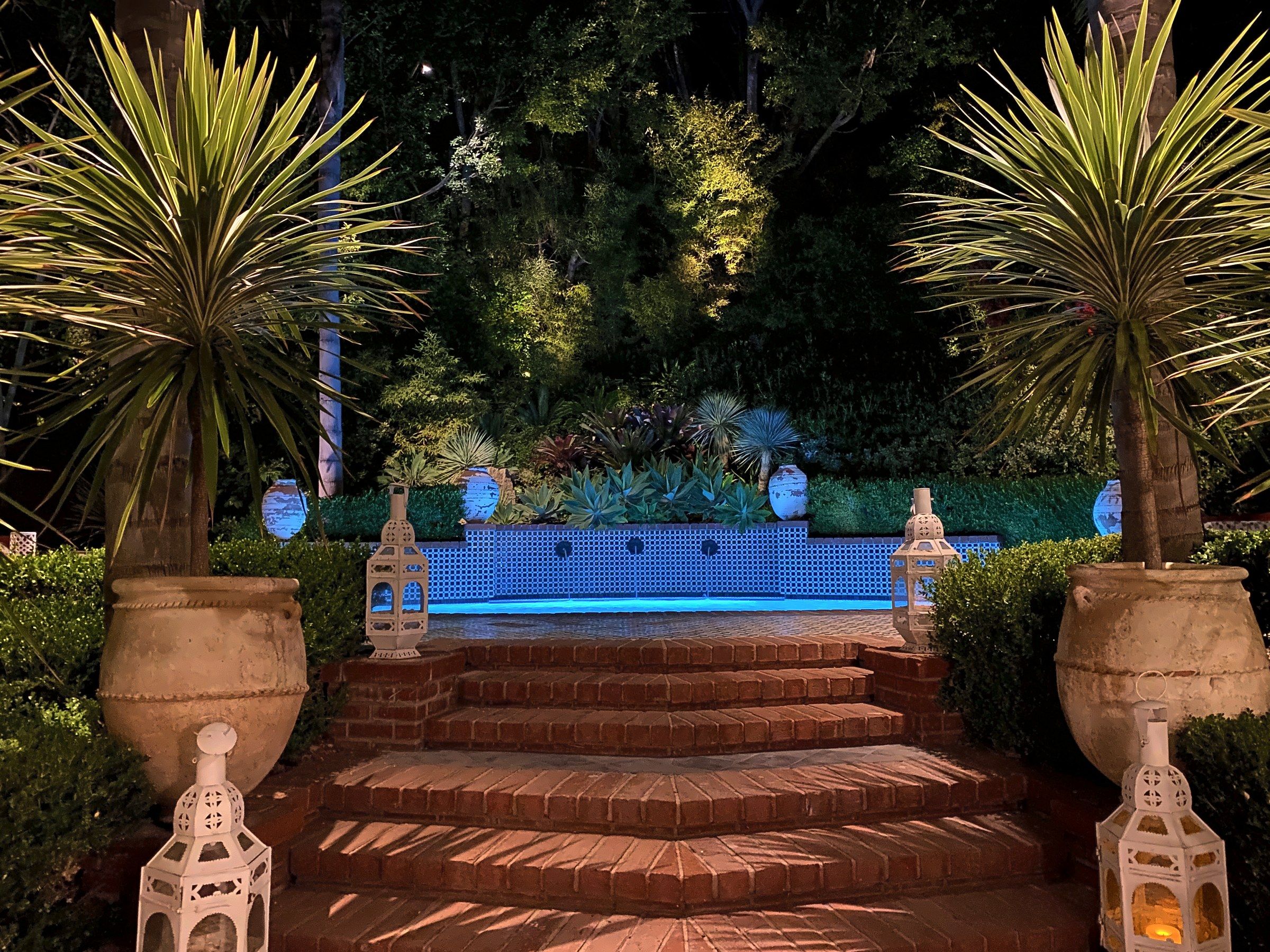 Moroccan lanterns flanking pool steps