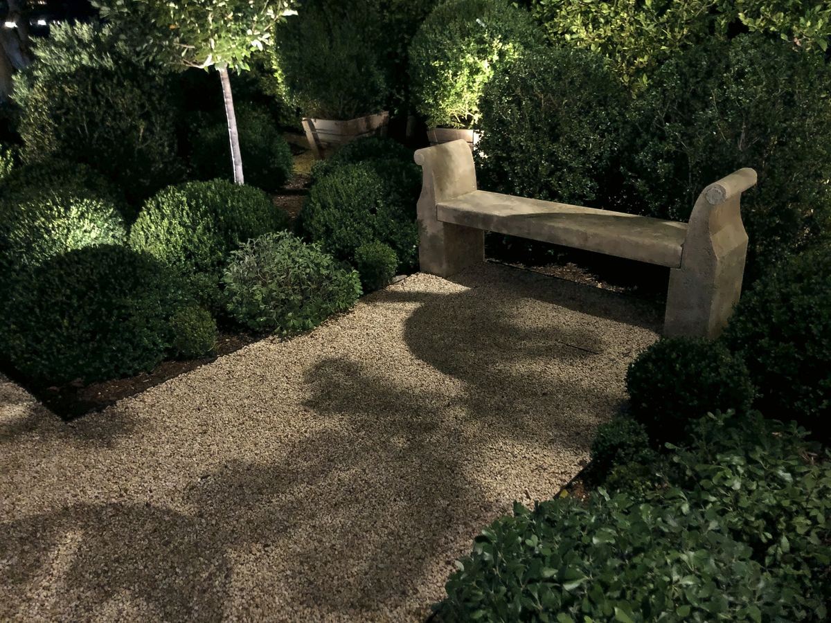 Stone bench moonlit topiary garden